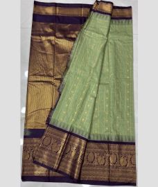 mint green colour gadwal pattu sarees with All over Buttas design