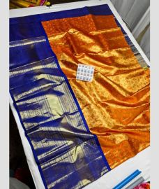 Orange and Navy Blue kanchi lehengas with All over design