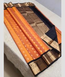 Lite Peach and Black kanchi pattu sarees with Koravai Border design