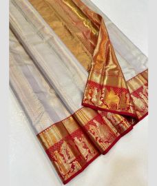 Half White and Red kanchi pattu sarees with Koravai Border design