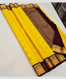 Yellow and Chocolate kanchi pattu sarees with Kuttu Border design