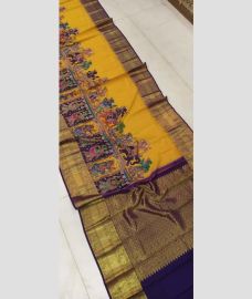Yellow and Navy blue kanchi pattu sarees with Kalamkari design