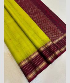 olive and magenta colour kanchi pattu sarees with All over Buttas design