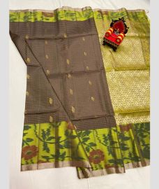 charcoal and green colour kanchi pattu sarees with pochampally border design