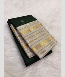 green colour kanchi pattu sarees with All over Buttas design