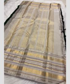 silver colour kanchi pattu sarees with All over Buttas design