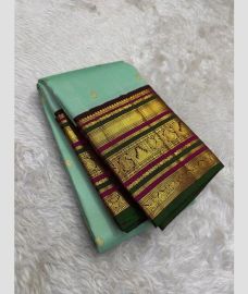 light blue colour kanchi pattu sarees with All over Buttas design
