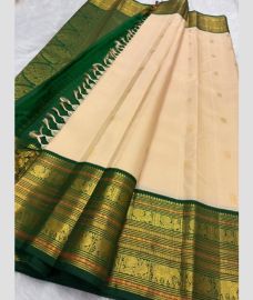 pink colour kanchi pattu sarees with All over Buttas design