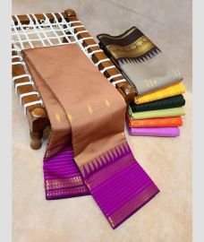 dark pink colour kanchi pattu sarees with All over Buttas design