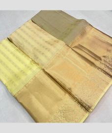 grey and cream colour kanchi pattu sarees with All over Buttas design