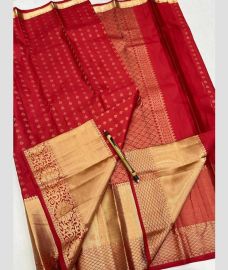 maroon red colour kanchi pattu sarees with All over Buttas design
