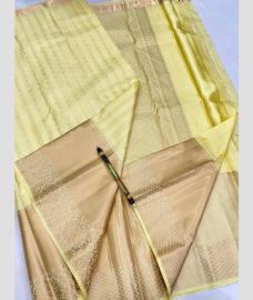 cream colour kanchi pattu sarees with All over Buttas design