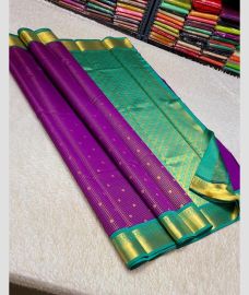 purple colour kanchi pattu sarees with All over Buttas design