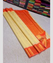 cream colour kanchi pattu sarees with All over Buttas design
