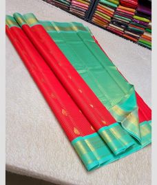 magenta red colour kanchi pattu sarees with All over Buttas design