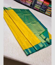 olive green and silver colour kuppadam pattu sarees with All over design