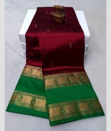 maroon red colour paithani sarees with All over Buttas design