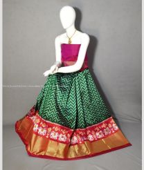 Forest Fall Green and Tomato Red color Ikkat Lehengas with pochampally ikkat design -IKPL0028645