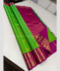 Parrot Green and Magenta color kanchi pattu sarees with koravai border design -KANP0013837