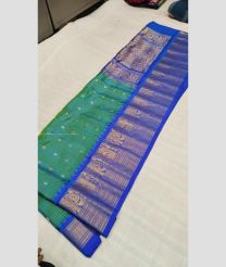 Turquoise and Blue color gadwal pattu handloom saree with all over small checks and buties design -GDWP0001322