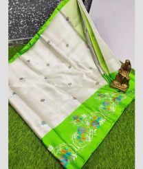 Half White and Parrot Green color linen sarees with all over embroidery hand work buties with tissue border design -LINS0003572