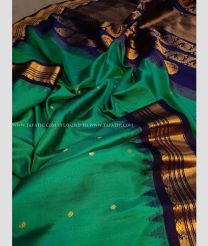 Dark Green saree with Black Border color gadwal pattu handloom saree with kuttu pallu and border with contrast blouse design