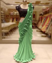 Light green with black contrast tone work ruffle saree